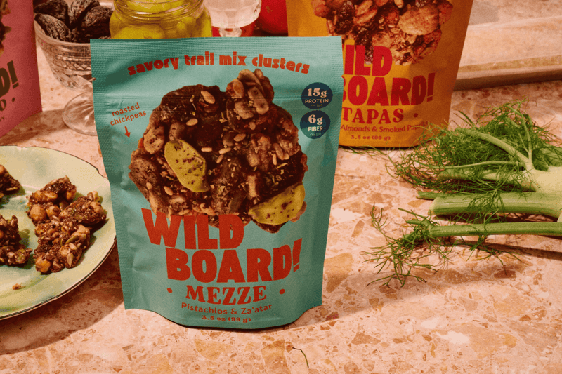 A mezze style spread with fennel, dips and a WildBoard Mezze pouch of savory trail mix clusters