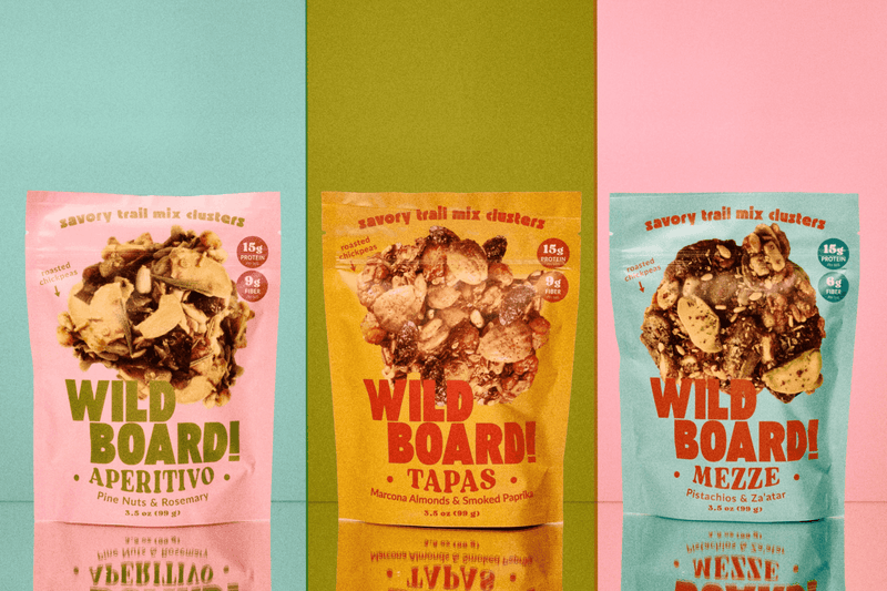 Three WildBoard pouches with the 15g protein and 12g fiber callouts visible on front of pack