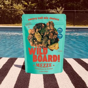 WildBoard Mezze savory trail mix clusters in a 3.5 ounce stand up pouch with 15g protein and 12g fiber callouts, made with pistachios and za'atar, vegan and made with gluten free ingredients
