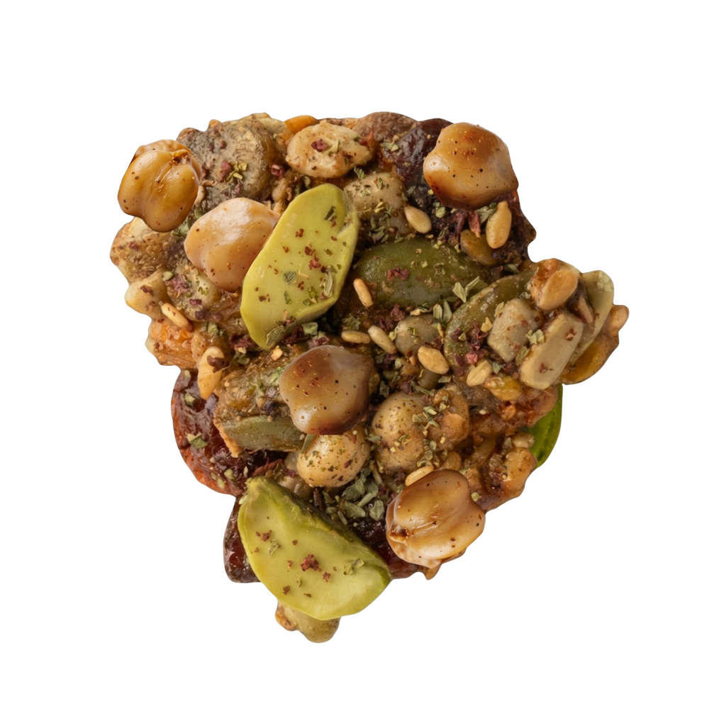 Close up of Mezze savory trail mix clusters made from roasted chickpeas, pistachios, pepitas, and za'atar seasoning